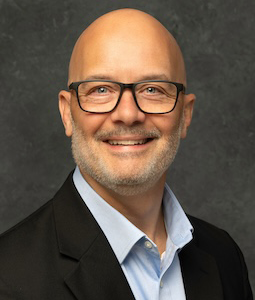 man in suit smiling