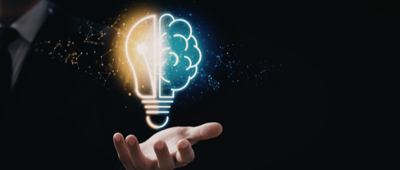 Hand holding a light bulb