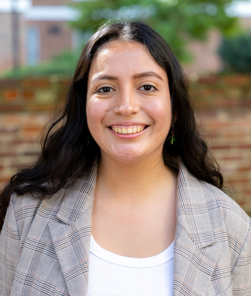a photo of Jazmine standing outside smiling.
