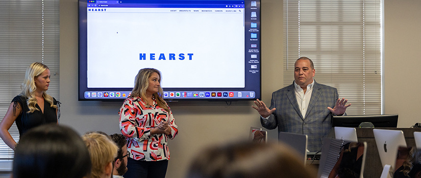 Hearst executive speaking to students