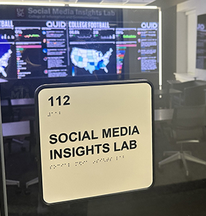 sign outside the social media insights lab, reads Room 112