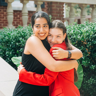 Top Scholars hugging