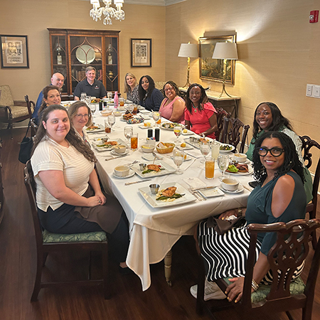 HRSM employees enjoy a lunch together at McCutchen House.