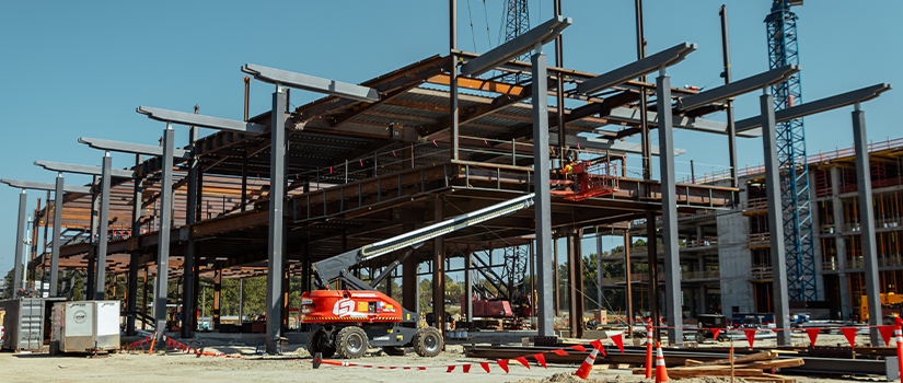 A ground-level view of the education wing of the health sciences building. Steel installation began in mid-August, 2025.
