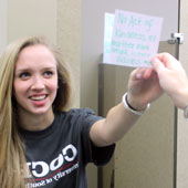Hayley Geis holds a handwritten note.