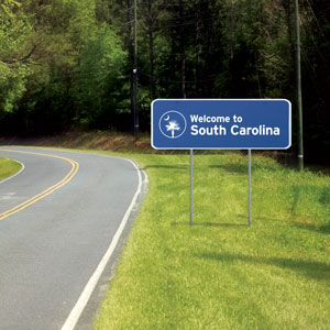 A South Carolina road with a “Welcome to South Carolina” sign