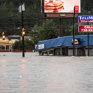 Flood waters in Columbia fill street and business
