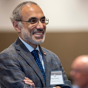 Dr. Fady Charbel smiles in conversation.